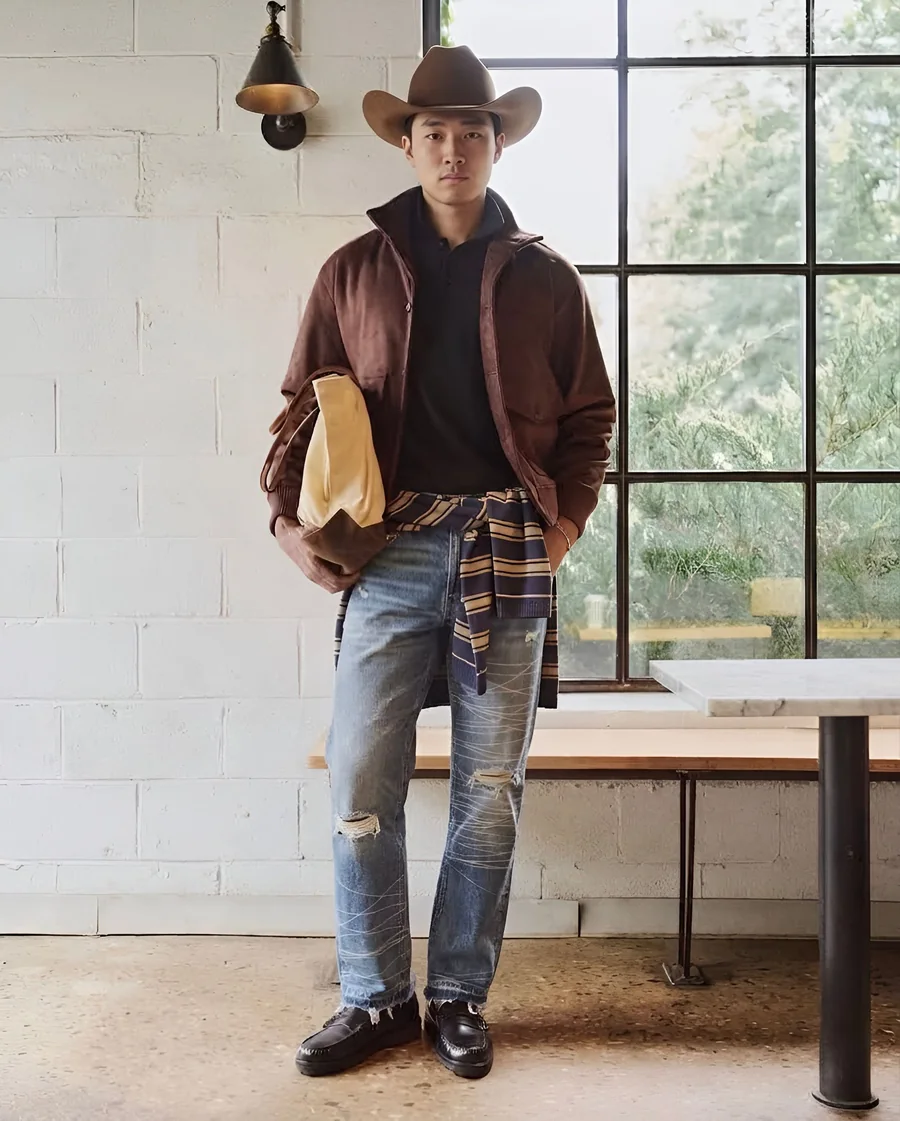 Light-wash ripped RANCHE jeans with a brown jacket