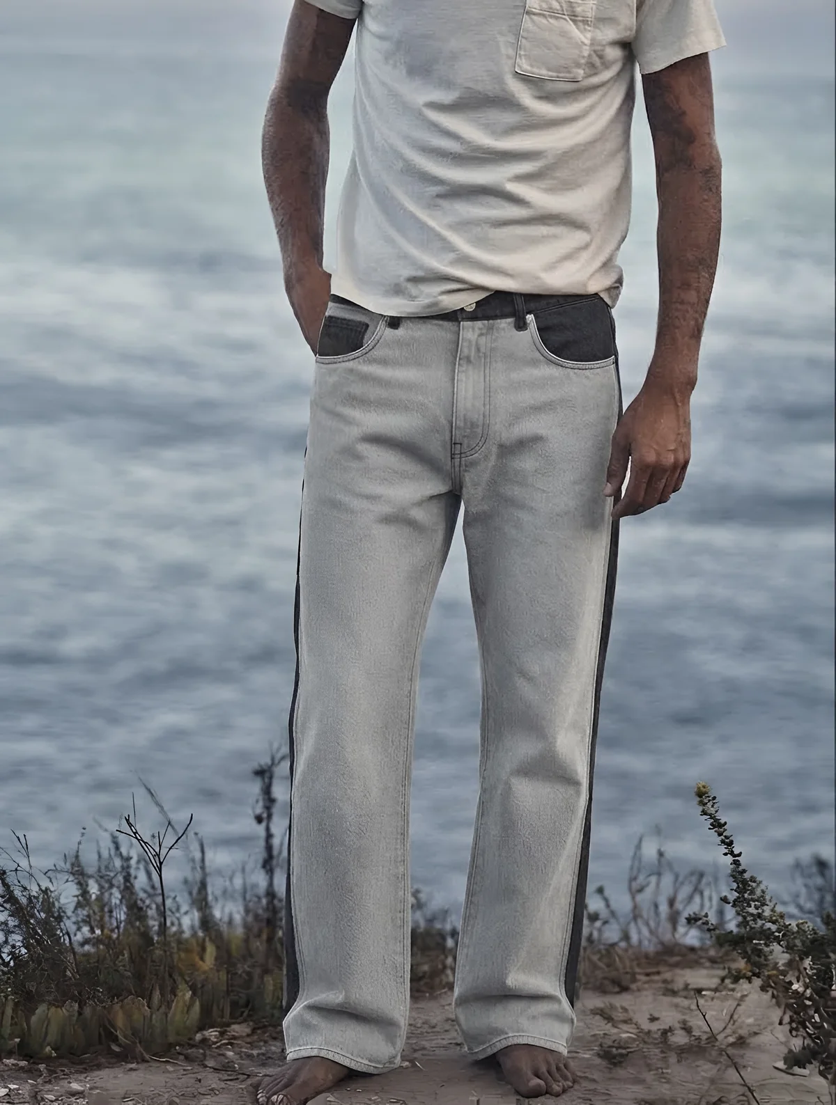 Two-tone RANCHE jeans on a coastal path
